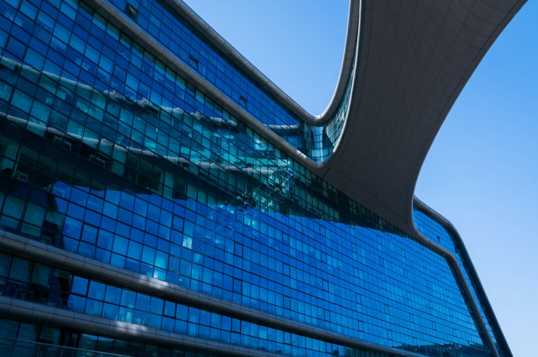 Glass facade of a modern corporate office building